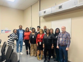 Section 8/Housing Choice Voucher Team taking a group photo with Author Rashad Hayes.