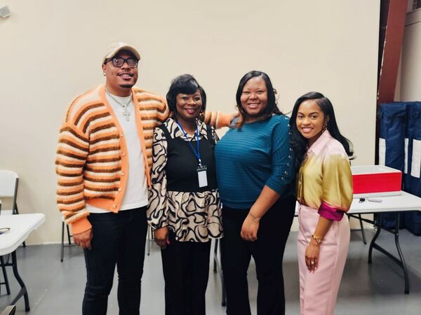 FSS Coordinator Cortlin Curry, HCV Supervisor Shundria Keye, FSS Case Manager Tekeyia Jones, and Guest Speaker Terah Stockdale Thomas taking a group photo.